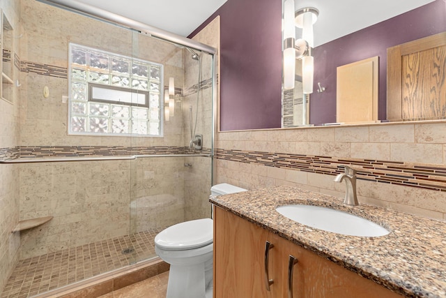 1803 Hubbard Ave, Saint Paul, MN 55104 - bathroom with a shower stall, vanity, tile patterned floors, and tile walls