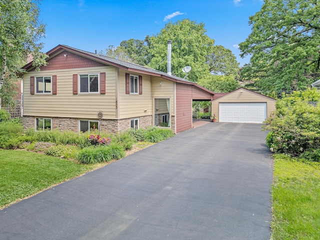 1803 Hubbard Ave, Saint Paul, MN 55104 - view of front of property with a garage, an outbuilding, and a front yard