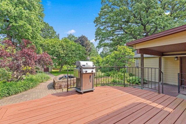 1803 Hubbard Ave, Saint Paul, MN 55104 - wooden terrace with area for grilling and a fire pit
