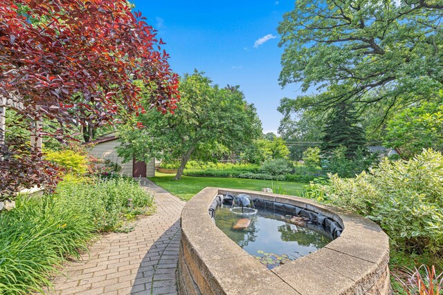 1803 Hubbard Ave, Saint Paul, MN 55104 - view of pool with a small pond and a yard