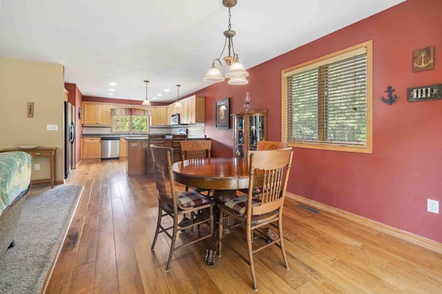 7270 Stone Rdg, Crow Wing Twp, MN 56401 - dining space with light wood-style floors and baseboards