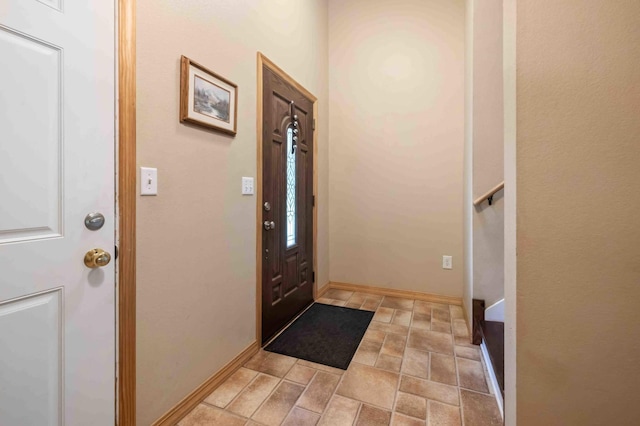 7270 Stone Rdg, Crow Wing Twp, MN 56401 - foyer entrance featuring stone finish floors and stairway