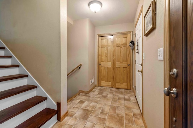 7270 Stone Rdg, Crow Wing Twp, MN 56401 - entrance foyer with stone finish flooring and stairway