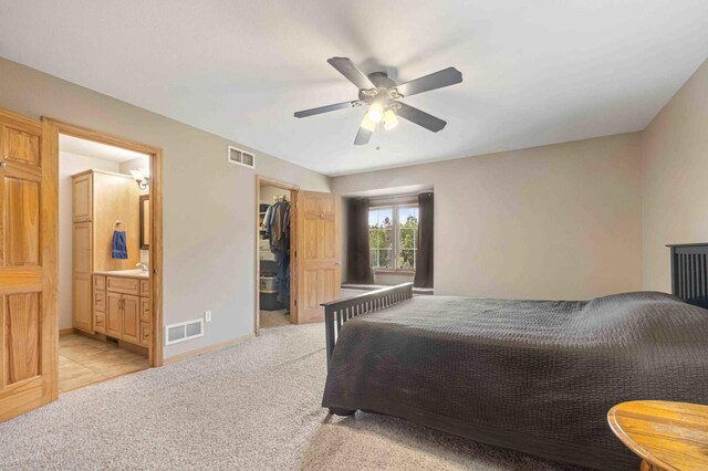7270 Stone Rdg, Crow Wing Twp, MN 56401 - bedroom featuring light colored carpet, ensuite bath, a spacious closet, ceiling fan, and a closet