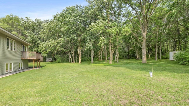 7270 Stone Rdg, Crow Wing Twp, MN 56401 - view of grassy yard featuring a wooden deck