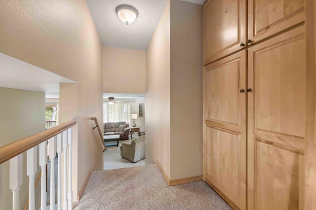 7270 Stone Rdg, Crow Wing Twp, MN 56401 - hallway featuring light colored carpet and an upstairs landing