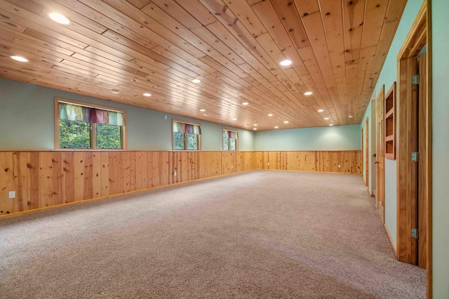 7270 Stone Rdg, Crow Wing Twp, MN 56401 - empty room featuring wainscoting, recessed lighting, wooden walls, carpet floors, and healthy amount of natural light