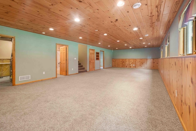 7270 Stone Rdg, Crow Wing Twp, MN 56401 - below grade area featuring recessed lighting, wood walls, wainscoting, carpet, and stairway