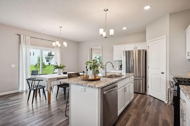 9266 26th St NE, Saint Michael, MN 55376 - kitchen featuring appliances with stainless steel finishes, a chandelier, dark wood-style flooring, plenty of natural light, and recessed lighting