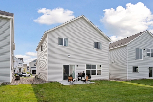 9266 26th St NE, Saint Michael, MN 55376 - rear view of property featuring a patio and a lawn