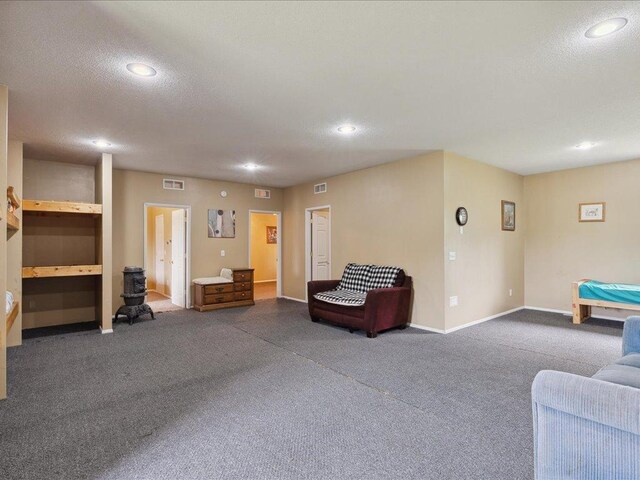 25935 310th St, Sebeka, MN 56477 - living room with dark carpet, recessed lighting, and a textured ceiling