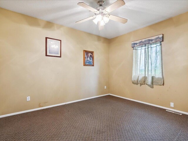 25935 310th St, Sebeka, MN 56477 - unfurnished room featuring dark carpet and ceiling fan