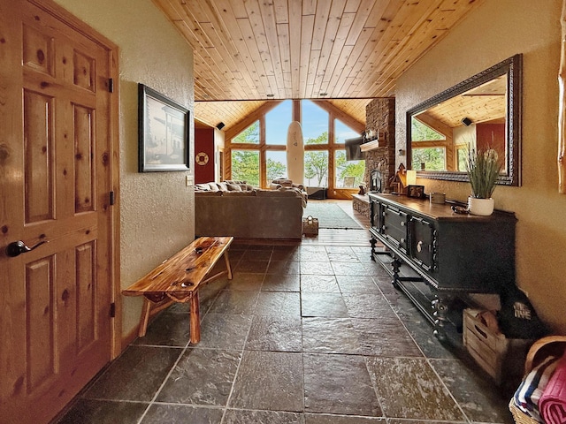 49512 202nd Pl, Shamrock Twp, MN 55760 - hallway with stone tile floors, wooden ceiling, vaulted ceiling, and a textured wall
