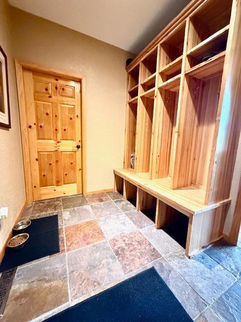 49512 202nd Pl, Shamrock Twp, MN 55760 - mudroom featuring stone tile flooring