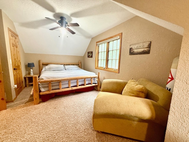 49512 202nd Pl, Shamrock Twp, MN 55760 - carpeted bedroom with a textured wall, lofted ceiling, a textured ceiling, and a ceiling fan