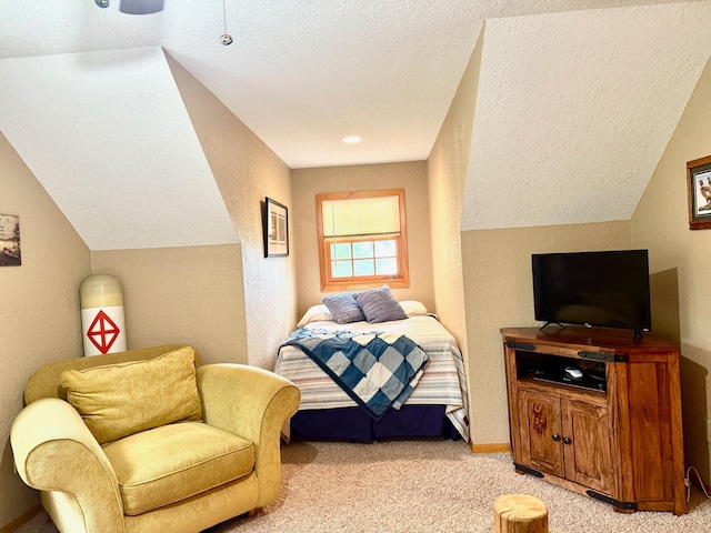 49512 202nd Pl, Shamrock Twp, MN 55760 - bedroom with light colored carpet, a textured ceiling, and vaulted ceiling