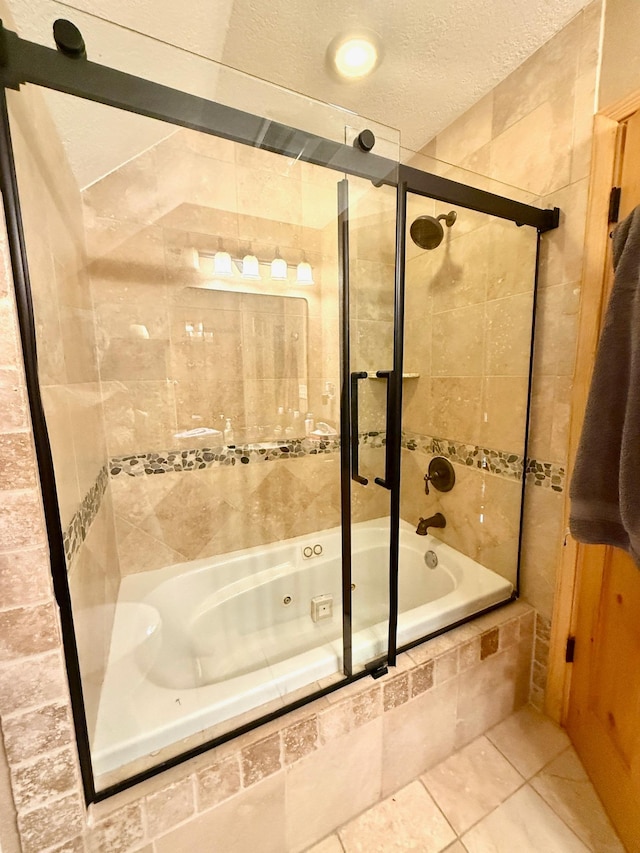 49512 202nd Pl, Shamrock Twp, MN 55760 - full bathroom with a combined bath / shower with jetted tub, tile patterned flooring, and a textured ceiling
