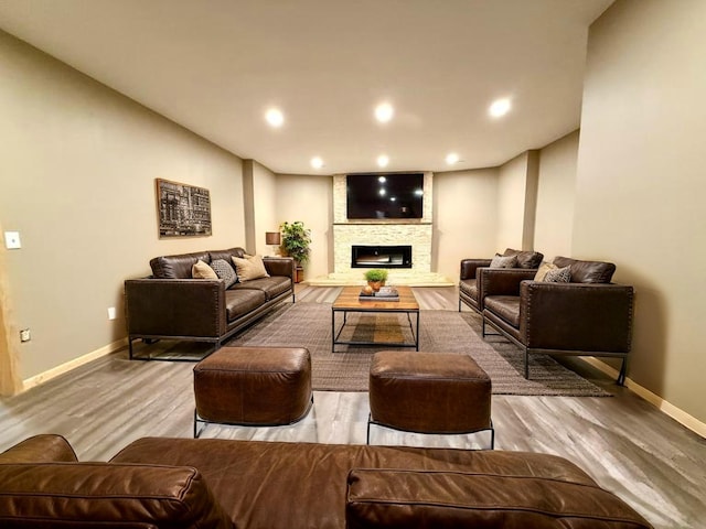 49512 202nd Pl, Shamrock Twp, MN 55760 - living room with wood finished floors, a fireplace, and recessed lighting