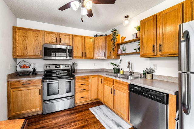 2533 Cobble Hill Ct Unit H, Woodbury, MN 55125 - kitchen featuring stainless steel appliances, a ceiling fan, dark wood-style floors, open shelves, and brown cabinets