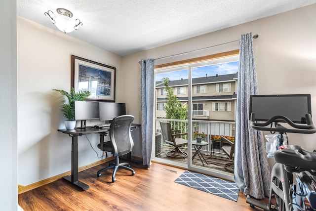 2533 Cobble Hill Ct Unit H, Woodbury, MN 55125 - office area featuring wood finished floors and a textured ceiling