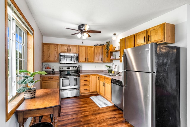 2533 Cobble Hill Ct Unit H, Woodbury, MN 55125 - kitchen with stainless steel appliances, open shelves, a ceiling fan, dark wood-type flooring, and brown cabinetry