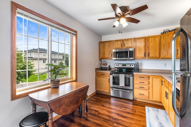 2533 Cobble Hill Ct Unit H, Woodbury, MN 55125 - kitchen with stainless steel appliances, dark wood-type flooring, ceiling fan, light countertops, and brown cabinets
