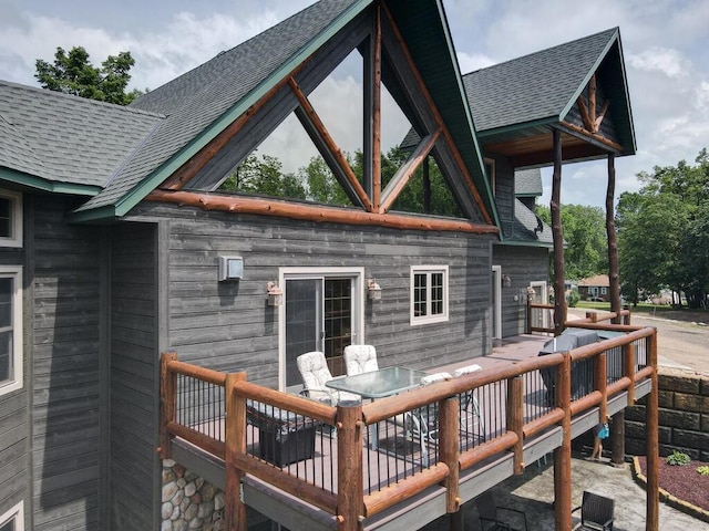 2406 Augusta Rd, Fair Haven Twp, MN 55382 - back of property featuring a shingled roof and outdoor dining space