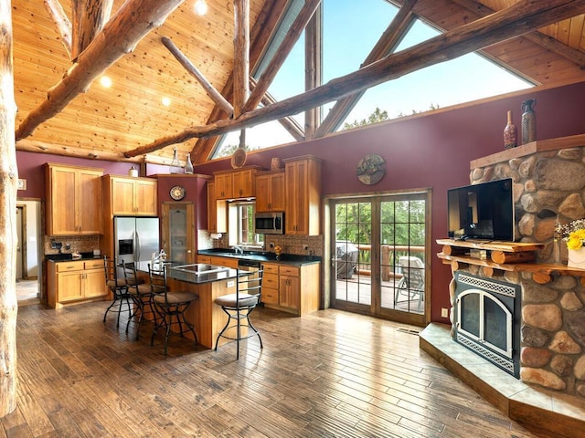 2406 Augusta Rd, Fair Haven Twp, MN 55382 - kitchen with stainless steel appliances, a wooden ceiling with exposed beams, dark countertops, high vaulted ceiling, and a kitchen breakfast bar
