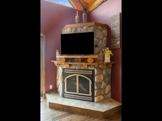 2406 Augusta Rd, Fair Haven Twp, MN 55382 - detailed view of a fireplace, wood finished floors, and wooden ceiling
