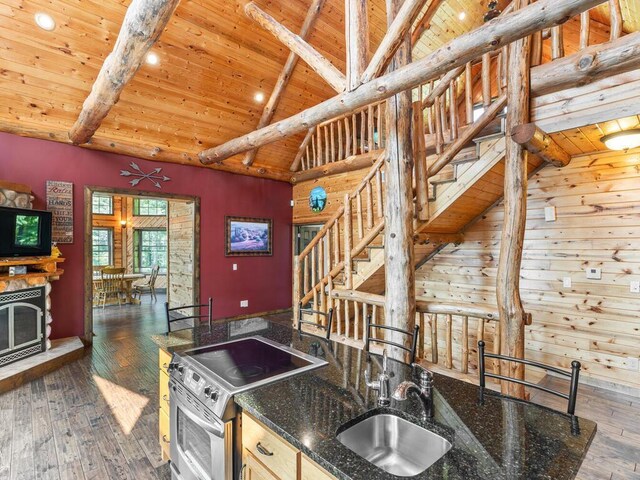 2406 Augusta Rd, Fair Haven Twp, MN 55382 - kitchen featuring stainless steel electric stove, a wooden ceiling with exposed beams, dark wood-style floors, high vaulted ceiling, and dark stone countertops