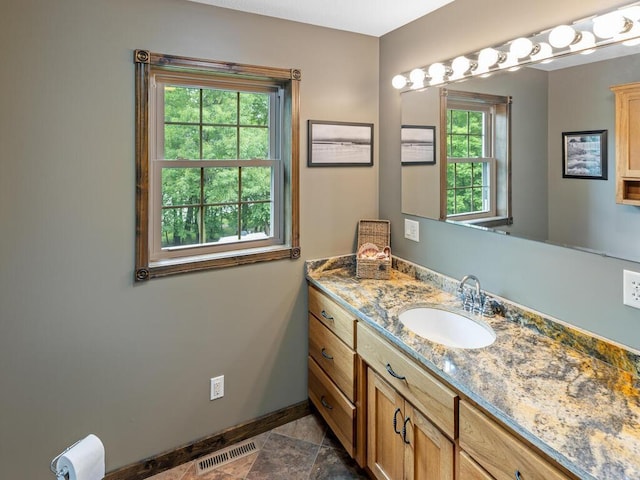 2406 Augusta Rd, Fair Haven Twp, MN 55382 - bathroom featuring baseboards and vanity