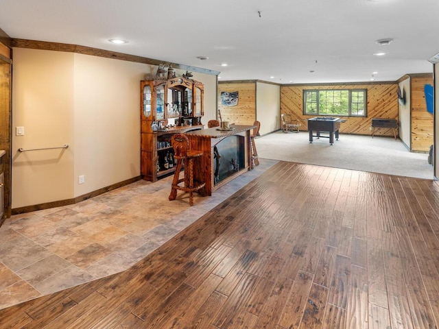 2406 Augusta Rd, Fair Haven Twp, MN 55382 - living area with wooden walls, light wood-style flooring, and recessed lighting