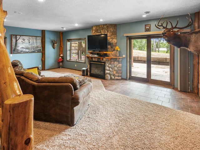 2406 Augusta Rd, Fair Haven Twp, MN 55382 - living area featuring a textured ceiling, a stone fireplace, recessed lighting, and tile patterned floors