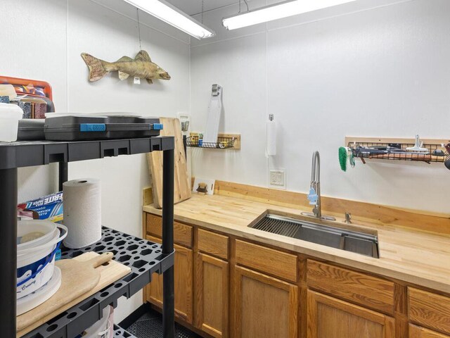 2406 Augusta Rd, Fair Haven Twp, MN 55382 - kitchen with butcher block counters and brown cabinetry