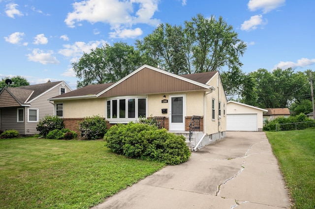 1306 Ryan Ave W, Roseville, MN 55113 - view of front facade featuring a garage, a front lawn, an outdoor structure, stucco siding, and brick siding
