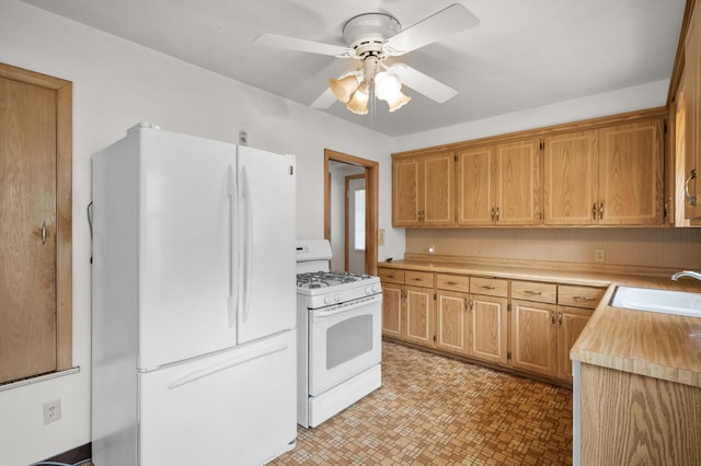 1306 Ryan Ave W, Roseville, MN 55113 - kitchen featuring white appliances, a ceiling fan, light countertops, and light flooring