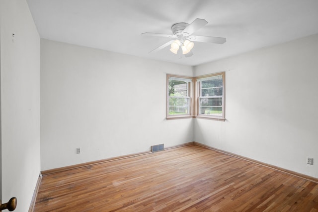 1306 Ryan Ave W, Roseville, MN 55113 - empty room with wood finished floors and ceiling fan
