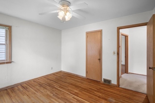 1306 Ryan Ave W, Roseville, MN 55113 - unfurnished bedroom with light wood-style flooring and ceiling fan