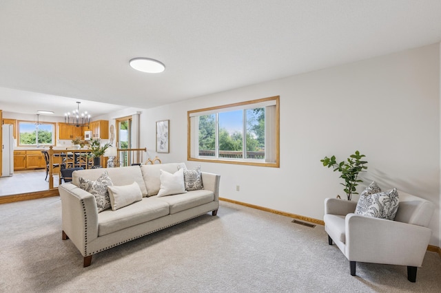 11817 51st St NE, Albertville, MN 55301 - living area with light colored carpet and a chandelier