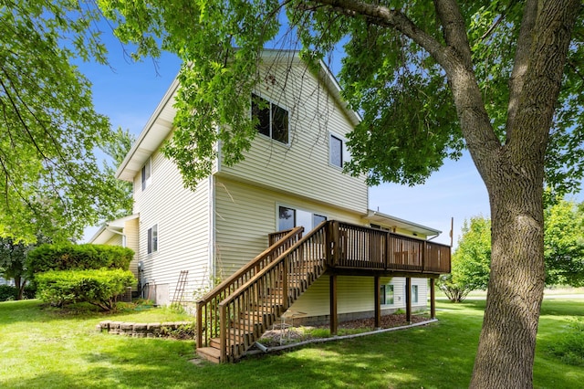 11817 51st St NE, Albertville, MN 55301 - back of property with a wooden deck, a lawn, and stairs