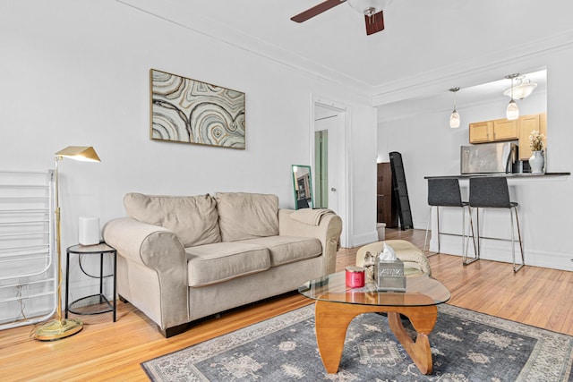 1820 1st Ave S Unit 208, Minneapolis, MN 55403 - living room with light wood-style flooring, crown molding, and ceiling fan