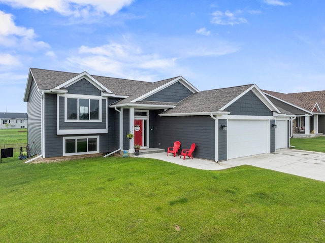 2105 Elk Run Dr SE, Pine Island, MN 55963 - view of front of home featuring a garage, a shingled roof, and a front lawn