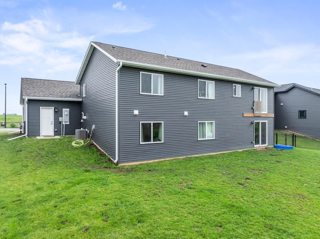 2105 Elk Run Dr SE, Pine Island, MN 55963 - back of house with a lawn and a shingled roof