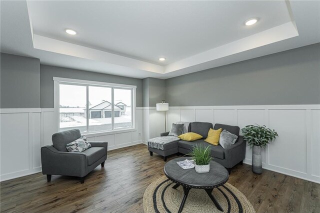 2105 Elk Run Dr SE, Pine Island, MN 55963 - sitting room featuring a tray ceiling, a decorative wall, a wainscoted wall, wood finished floors, and recessed lighting