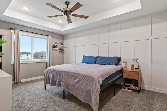 2105 Elk Run Dr SE, Pine Island, MN 55963 - bedroom with a raised ceiling, carpet floors, recessed lighting, a decorative wall, and ceiling fan
