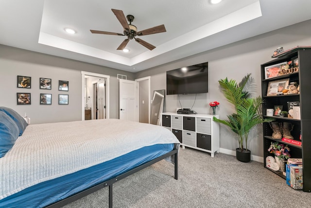 2105 Elk Run Dr SE, Pine Island, MN 55963 - bedroom featuring a raised ceiling, light colored carpet, recessed lighting, and ceiling fan