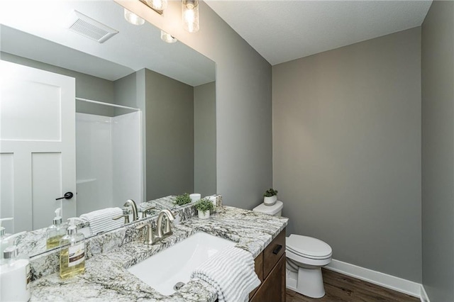 2105 Elk Run Dr SE, Pine Island, MN 55963 - full bath with wood finished floors, vanity, and a shower
