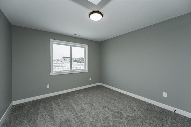 2105 Elk Run Dr SE, Pine Island, MN 55963 - empty room with dark carpet and baseboards