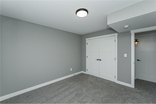 2105 Elk Run Dr SE, Pine Island, MN 55963 - unfurnished bedroom featuring dark carpet and a closet
