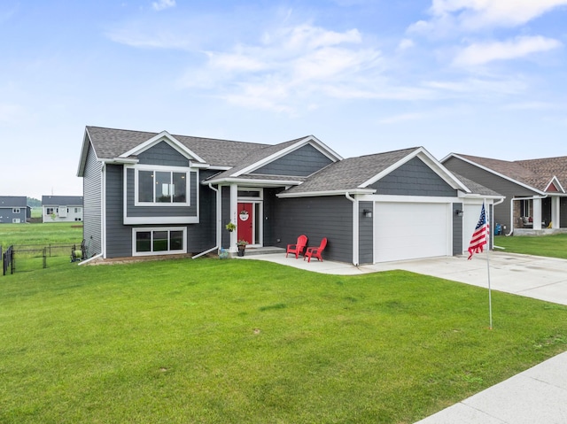 2105 Elk Run Dr SE, Pine Island, MN 55963 - view of front facade featuring an attached garage, concrete driveway, and roof with shingles